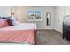 Comfortable carpeted bedroom featuring a large window and plenty of closet space at 1294 S Troy St, Aurora, CO 80012