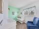 Charming Bedroom with soft mint walls and a white crib at 1294 S Troy St, Aurora, CO 80012
