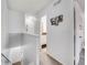 Upstairs hallway leading to bedrooms, a full bathroom, and other areas of the home at 1294 S Troy St, Aurora, CO 80012