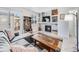 Inviting living room with a modern fireplace, TV, and sliding doors to an outdoor patio at 1294 S Troy St, Aurora, CO 80012