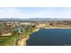 Aerial view of a lake and park with mountains in the background on a clear day at 3842 Zenobia St, Denver, CO 80212