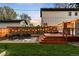 Backyard with deck, modern furniture, patio, string lights, and lawn at 3842 Zenobia St, Denver, CO 80212