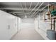 Spacious basement area featuring painted walls and exposed ceiling pipes at 3842 Zenobia St, Denver, CO 80212