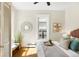Sunny bedroom featuring hardwood floors, modern accents, and a comfortable bed at 3842 Zenobia St, Denver, CO 80212