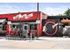 Pizza and beer restaurant boasts a vibrant red facade and outdoor seating at 3842 Zenobia St, Denver, CO 80212