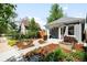 Landscaped front yard and walkway lead to the home's entrance at 3842 Zenobia St, Denver, CO 80212