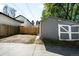 View of a detached garage with parking area and fenced yard at 3842 Zenobia St, Denver, CO 80212
