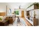 Inviting living room with a ceiling fan, hardwood floors, and built-in shelving at 3842 Zenobia St, Denver, CO 80212