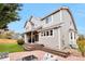 Backyard featuring a spacious patio, green grass and mature trees at 8958 Forrest Dr, Highlands Ranch, CO 80126