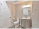 Bathroom features a neutral color palette, vanity and toilet at 8958 Forrest Dr, Highlands Ranch, CO 80126