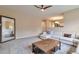 Spacious living room with a cozy sectional sofa, wooden coffee table, and an open view to the kitchen area at 8958 Forrest Dr, Highlands Ranch, CO 80126