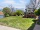 Large backyard features a spacious grassy lawn, wood deck with overhead structure, and mature landscaping at 6500 S Downing St, Centennial, CO 80121