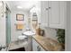 Bright bathroom featuring a pedestal sink, white cabinetry, and a glass shower at 6500 S Downing St, Centennial, CO 80121