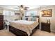 Cozy bedroom with ceiling fan, natural light, and decorative furnishings at 6500 S Downing St, Centennial, CO 80121