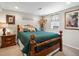 Charming bedroom with a wooden bed frame, comfortable bedding, and warm lighting at 6500 S Downing St, Centennial, CO 80121