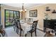Elegant dining room featuring a chandelier, large windows, and access to the backyard at 6500 S Downing St, Centennial, CO 80121