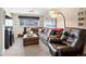 Comfortable living room with large sectional sofa, ottoman, and stylish decor at 6500 S Downing St, Centennial, CO 80121
