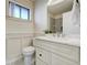 Bright bathroom with a marble countertop vanity, a neutral color palette, and modern fixtures at 9967 Lane St, Thornton, CO 80260