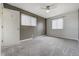Spacious bedroom featuring neutral walls, large windows with blinds and a ceiling fan at 9967 Lane St, Thornton, CO 80260