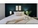 Serene main bedroom featuring a luxurious king-size bed and decorative accent wall at 9967 Lane St, Thornton, CO 80260
