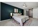 Spacious bedroom with a sliding barn door, large closet, and stylish contemporary decor at 9967 Lane St, Thornton, CO 80260