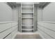 Spacious walk-in closet with built-in shelving and ample storage space at 9967 Lane St, Thornton, CO 80260