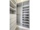 Bright walk-in closet featuring custom shelving and drawer organization, ideal for storage at 9967 Lane St, Thornton, CO 80260