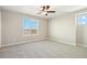 Bright bedroom with neutral carpeting, a ceiling fan, and an attractive window providing an abundance of natural light at 9484 Yampa St, Commerce City, CO 80022