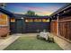 Private backyard features a small turf area, decorative gravel, string lights, and a dining set for outdoor enjoyment at 2731 W 42Nd Ave, Denver, CO 80211