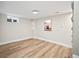 Basement area with wood floors, a small window, and neutral wall color at 2731 W 42Nd Ave, Denver, CO 80211