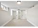 Finished basement with carpet, white walls, and a window for natural light at 2731 W 42Nd Ave, Denver, CO 80211