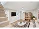 Finished basement featuring neutral walls, carpeted stairs, and entertainment setup at 2731 W 42Nd Ave, Denver, CO 80211