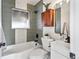 Updated bathroom features modern gray tiling and fixtures at 2731 W 42Nd Ave, Denver, CO 80211