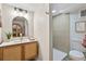 This bathroom features a tiled shower, modern fixtures, and a view of the toilet at 2731 W 42Nd Ave, Denver, CO 80211