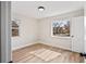 Bright bedroom featuring views of the neighborhood and wood-look vinyl plank flooring at 2731 W 42Nd Ave, Denver, CO 80211