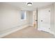 Cozy bedroom with neutral carpet and paint, a casement window, and white trim for a clean, bright feel at 2731 W 42Nd Ave, Denver, CO 80211