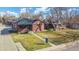 Charming brick home featuring a well-manicured lawn and inviting curb appeal at 2731 W 42Nd Ave, Denver, CO 80211