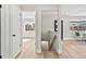 Bright hallway with natural light, wood floors, and open access to the rooms at 2731 W 42Nd Ave, Denver, CO 80211