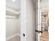 Bright hallway showing a walk-in closet and an adjacent bathroom with a toilet at 2731 W 42Nd Ave, Denver, CO 80211