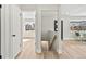 Inviting hallway showcasing wood floors, with views of the living spaces and staircase at 2731 W 42Nd Ave, Denver, CO 80211