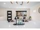 Bright kitchen featuring a quartz countertop island with a seating area and modern décor at 2731 W 42Nd Ave, Denver, CO 80211