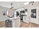 Modern kitchen with white cabinets, an island, and stainless steel appliances at 2731 W 42Nd Ave, Denver, CO 80211