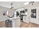 Modern kitchen featuring stainless steel appliances, white cabinets, and a large island at 2731 W 42Nd Ave, Denver, CO 80211