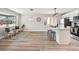 Open-concept kitchen features new appliances, quartz countertops, bar seating, and modern lighting at 2731 W 42Nd Ave, Denver, CO 80211