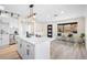 Bright kitchen featuring quartz counters, white cabinets, and hardwood floors at 2731 W 42Nd Ave, Denver, CO 80211