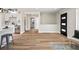 Spacious open floor plan features bright, natural light, modern flooring, and an open kitchen with stainless appliances at 2731 W 42Nd Ave, Denver, CO 80211