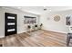 Living room with light wood floors, modern front door, and a large window with seating at 2731 W 42Nd Ave, Denver, CO 80211