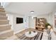 Inviting living room showcasing modern decor, built-in shelving, and comfortable seating area at 2731 W 42Nd Ave, Denver, CO 80211