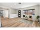 Inviting living room with light wood floors, a modern rug, and plenty of natural light at 2731 W 42Nd Ave, Denver, CO 80211