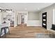 Open-concept living area with wood flooring, modern decor, and plenty of natural light at 2731 W 42Nd Ave, Denver, CO 80211